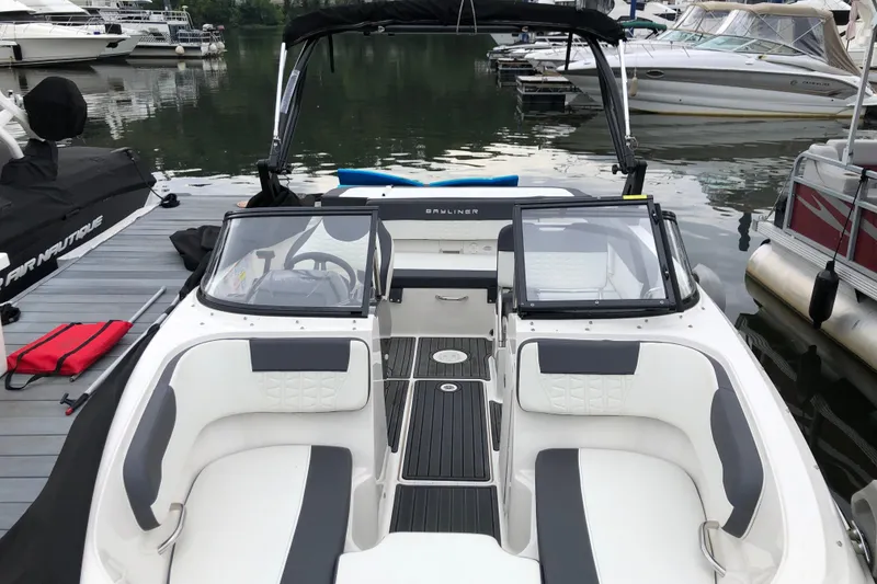 Slide: The Image of 2021 Bayliner VR5 Bowrider I/O docked, featuring spacious seating and sleek design. - 3