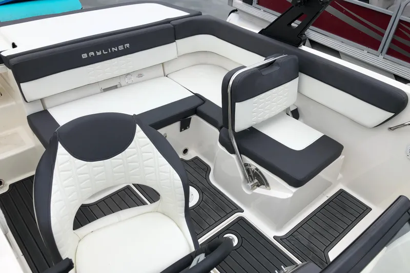 Slide: The Image of 2021 Bayliner VR5 Bowrider I/O interior with white and black seating, modern design. - 4