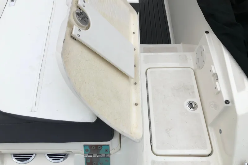 Slide: The Image of 2021 Bayliner VR5 Bowrider I/O boat interior with storage compartment and seating. - 6