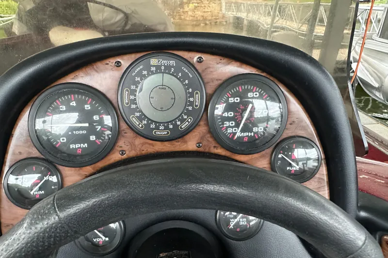 Slide: The Image of Dashboard of 1999 Tracker Bass Tracker 896 DC boat with gauges and steering wheel. - 10