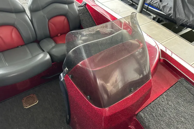 Slide: The Image of 1999 Tracker Bass Tracker 896 DC boat interior with red and gray seating. - 3