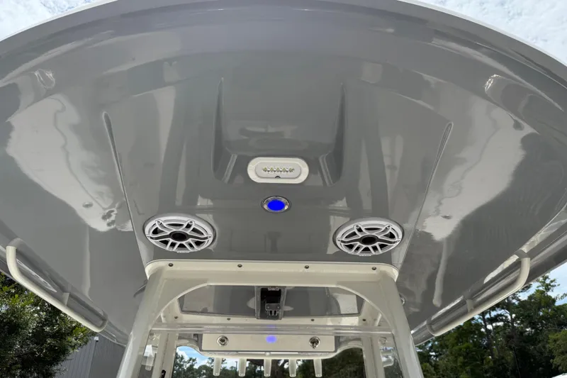 Slide: The Image of 2022 Cobia 240 Center Console boat roof with speakers and lighting. - 17
