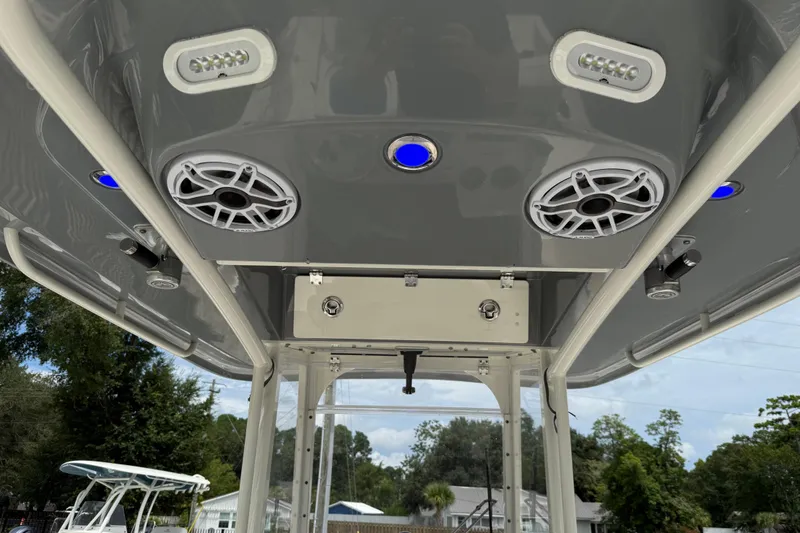 Slide: The Image of 2022 Cobia 240 Center Console boat roof with speakers and LED lights. - 18