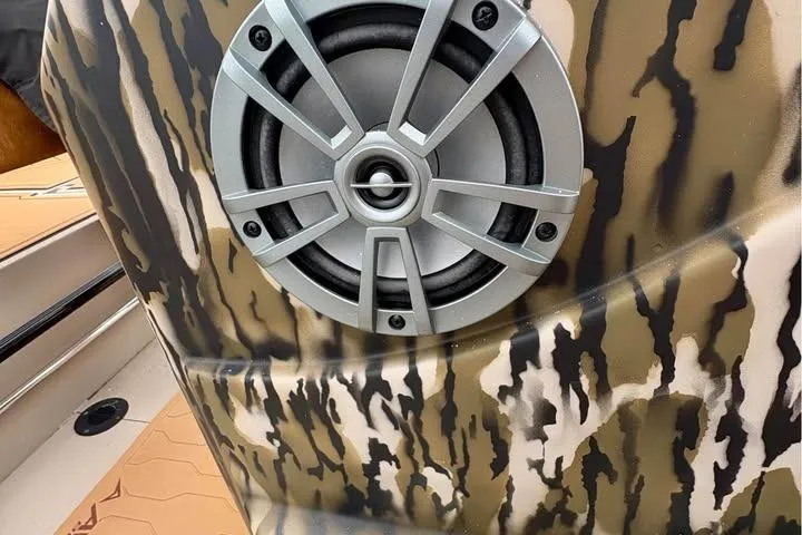Slide: The Image of Camouflage-patterned speaker on 2024 Avid 20 Rogue boat interior. - 7