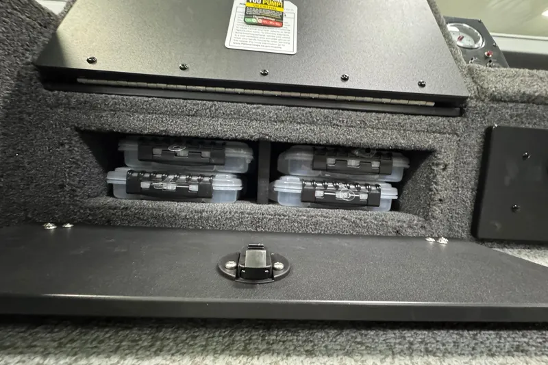 Slide: The Image of Storage compartment in 2025 Crestliner 1850 Pro Tiller boat with organized tackle boxes. - 15