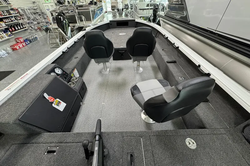 Slide: The Image of 2025 Crestliner 1850 Pro Tiller boat interior with seating and control panel. - 7
