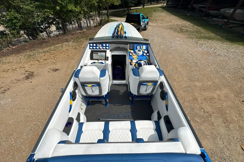 Slide: The Image of 2001 Cigarette 38 Top Gun boat interior with blue and white seating and control panel. - 12