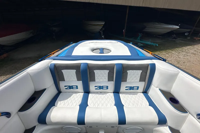 Slide: The Image of 2001 Cigarette 38 Top Gun boat interior with blue and white seating, featuring "38" embroidery. - 13