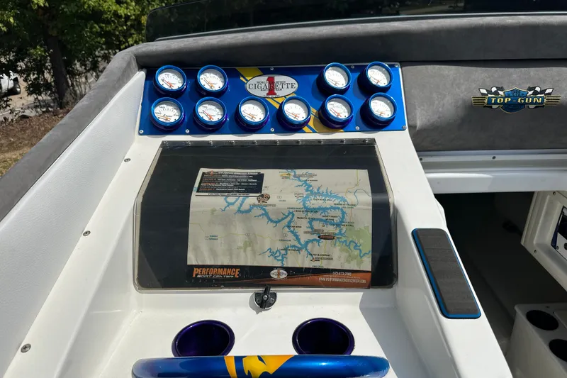 Slide: The Image of Dashboard of a 2001 Cigarette 38 Top Gun boat with gauges and a map. - 16