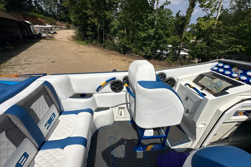 Slide: The Image of 2001 Cigarette 38 Top Gun boat interior with blue and white seating and dashboard. - 21