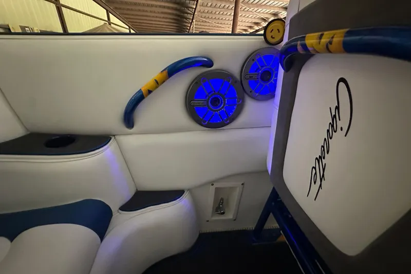 Slide: The Image of Interior of 2001 Cigarette 38 Top Gun boat with blue-lit speakers and custom seating. - 25