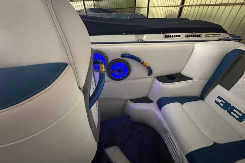 Slide: The Image of Interior of 2001 Cigarette 38 Top Gun boat with blue accents and illuminated speakers. - 27
