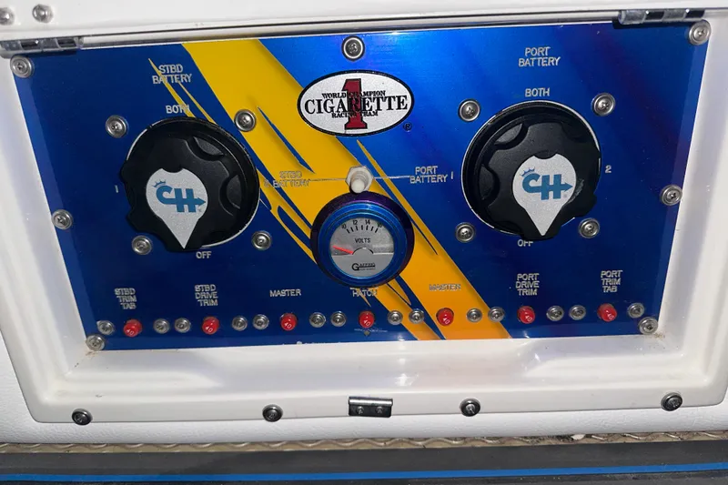 Slide: The Image of Control panel of a 2001 Cigarette 38 Top Gun boat with battery switches. - 28