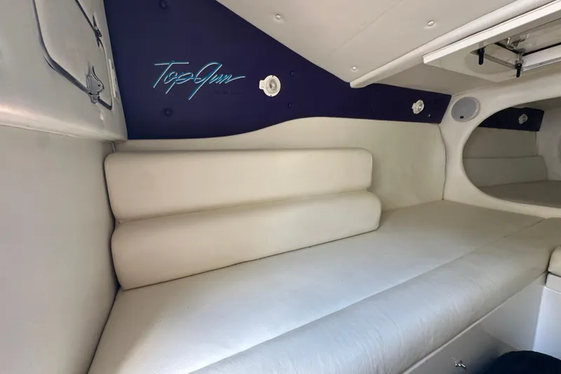 Slide: The Image of Interior of a 2001 Cigarette 38 Top Gun boat with white seating. - 33