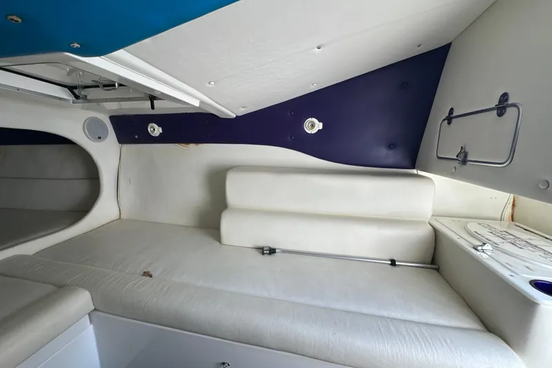 Slide: The Image of Interior cabin of 2001 Cigarette 38 Top Gun boat with white seating. - 34
