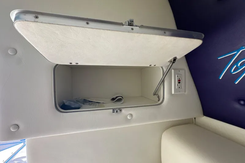 Slide: The Image of Open storage compartment in 2001 Cigarette 38 Top Gun boat interior. - 36