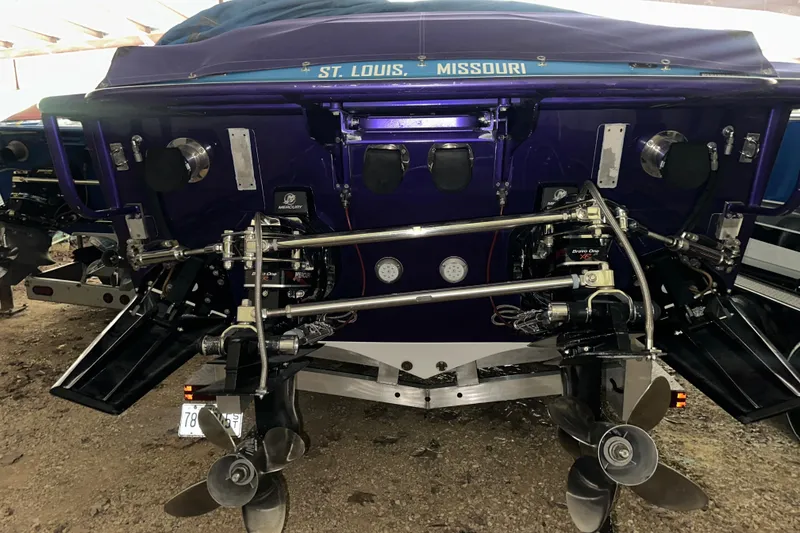 Slide: The Image of Rear view of a 2001 Cigarette 38 Top Gun boat with dual propellers. - 38