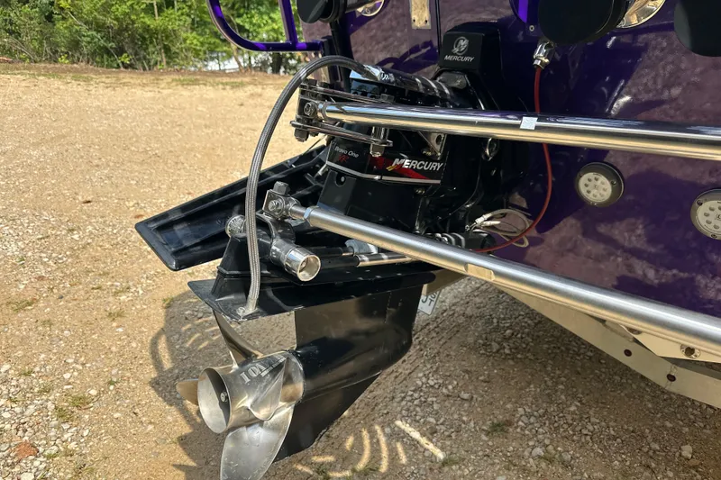 Slide: The Image of 2001 Cigarette 38 Top Gun boat with Mercury Bravo One XR outdrive, parked on gravel. - 40