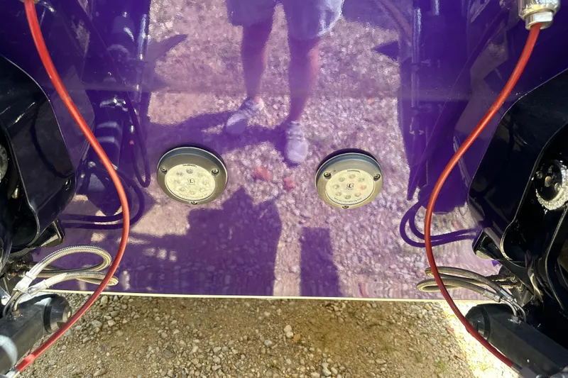 Slide: The Image of 2001 Cigarette 38 Top Gun boat with purple hull and visible wiring. - 42