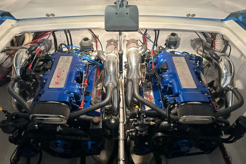 Slide: The Image of Twin engines in a 2001 Cigarette 38 Top Gun boat, showcasing powerful performance. - 43
