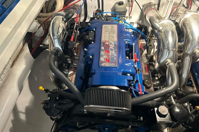 Slide: The Image of Engine of a 2001 Cigarette 38 Top Gun boat, featuring Mercury Racing components. - 46