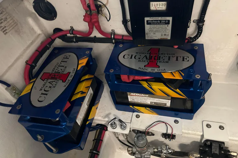 Slide: The Image of Engine compartment of a 2001 Cigarette 38 Top Gun boat with AC Delco batteries. - 48