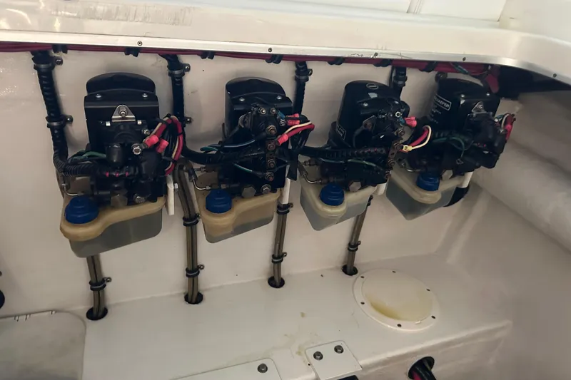 Slide: The Image of 2001 Cigarette 38 Top Gun engine compartment with hydraulic systems and wiring. - 50