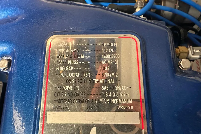 Slide: The Image of 2001 Cigarette 38 Top Gun engine specifications plate with technical details. - 51