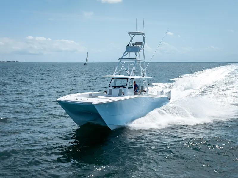 The Image of 2024 Freeman NEW QUAD V10s 400 HP boat cruising on open water. - 0