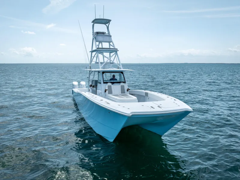 Slide: The Image of 2024 Freeman NEW QUAD V10s 400 HP boat on open water. - 10