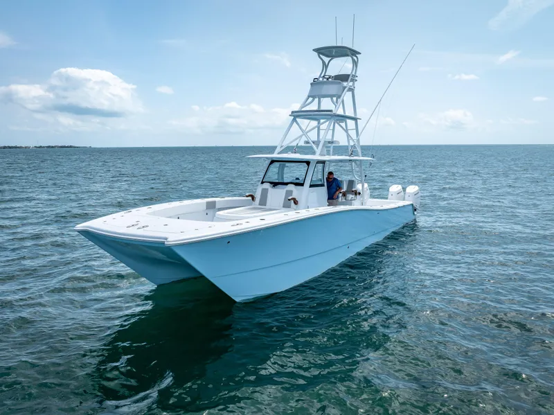 Slide: The Image of 2024 Freeman NEW QUAD V10s 400 HP boat on open water. - 12