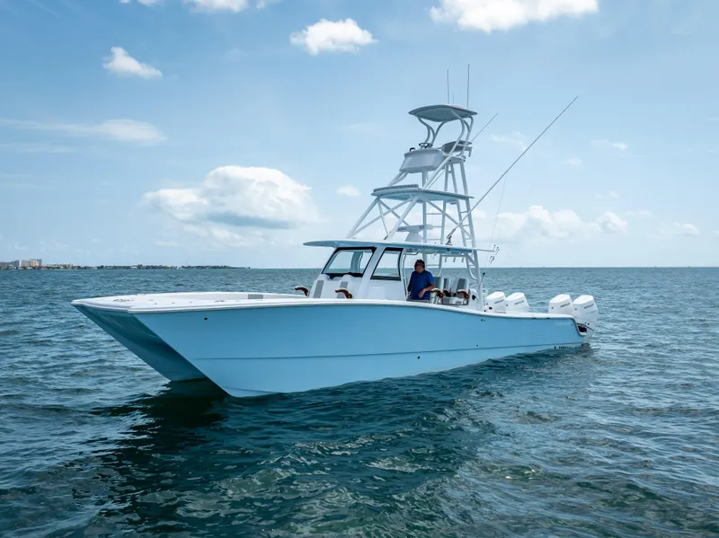 Slide: The Image of Freeman NEW 2024 boat with Quad V10s 400 HP engines on open water. - 13