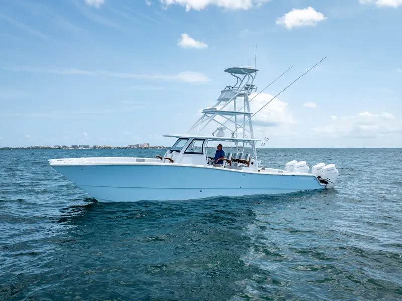 Slide: The Image of Freeman NEW 2024 boat with Quad V10s 400 HP engines on open water. - 14