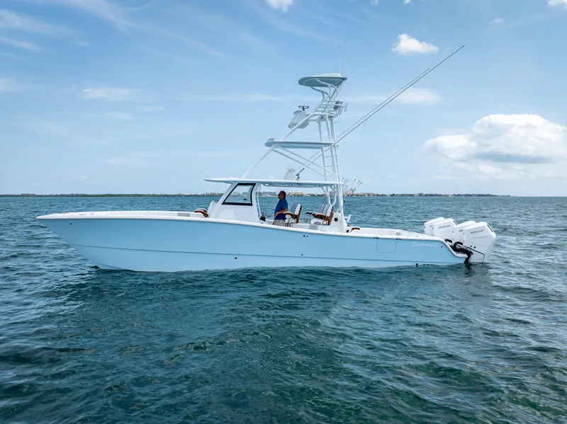 Slide: The Image of 2024 Freeman boat with Quad V10s 400 HP engines on open water. - 15