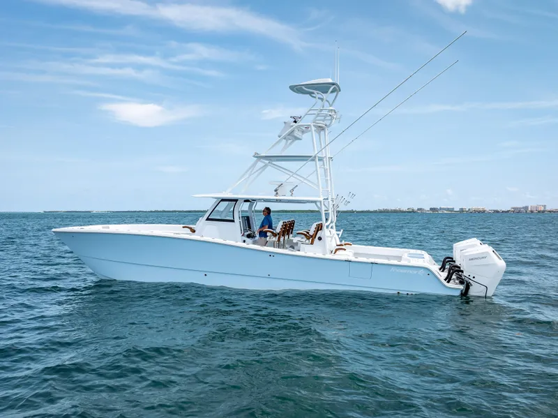 Slide: The Image of 2024 Freeman boat with Quad V10s 400 HP engines on open water. - 16