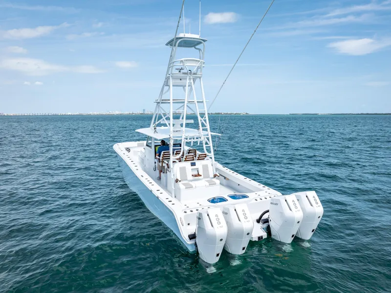 Slide: The Image of Freeman NEW 2024 boat with quad V10 400 HP engines on open water. - 19