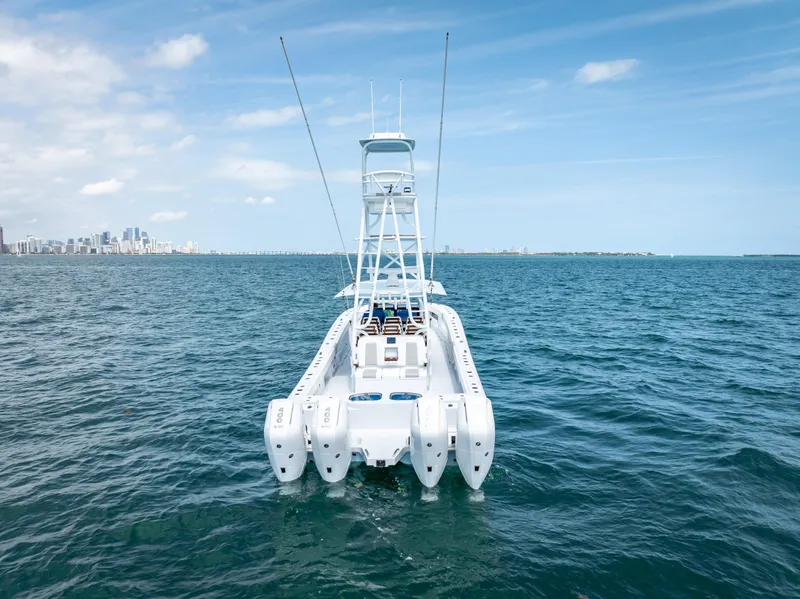 Slide: The Image of Freeman NEW 2024 boat with quad V10s 400 HP engines on open water. - 21