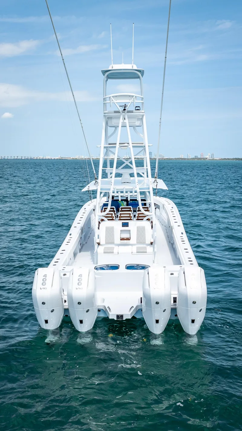 Slide: The Image of Freeman 2024 boat with quad V10 400 HP engines on open water. - 22