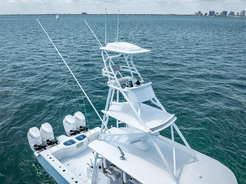 Slide: The Image of Freeman NEW 2024 boat with quad V10s 400 HP engines on open water. - 26