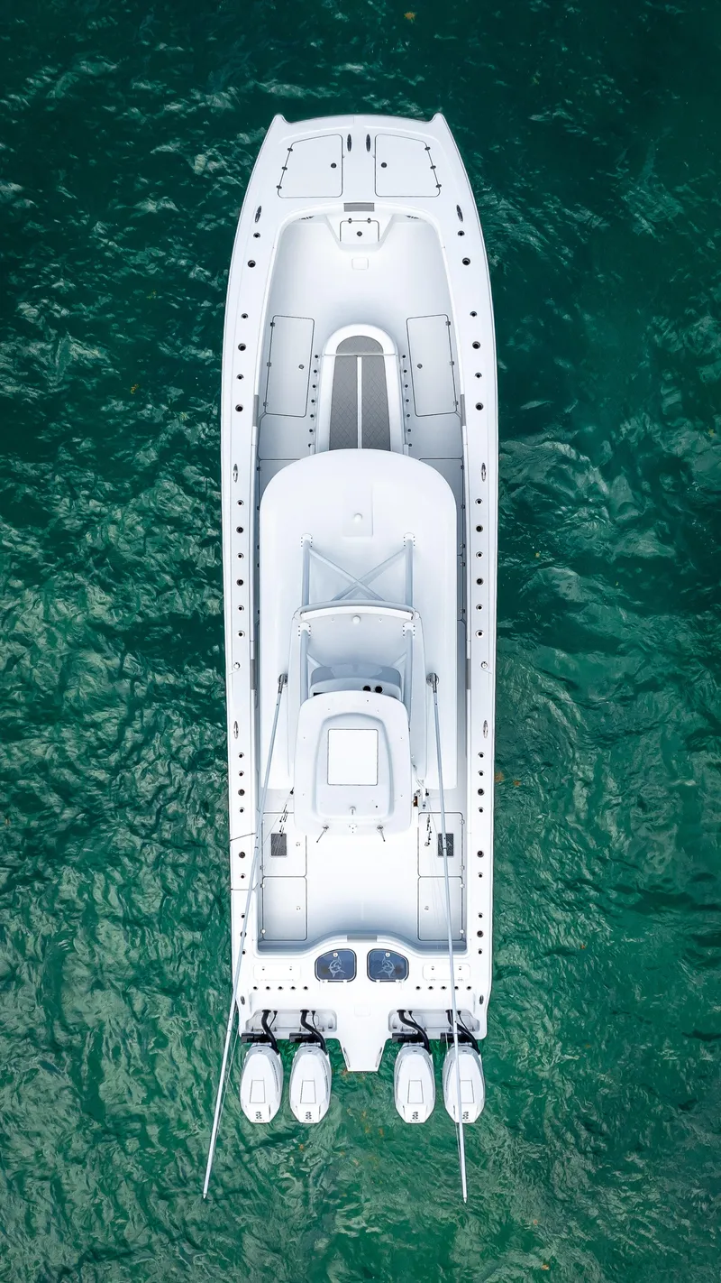 Slide: The Image of Top view of 2024 Freeman NEW QUAD V10s 400 HP boat on water. - 31