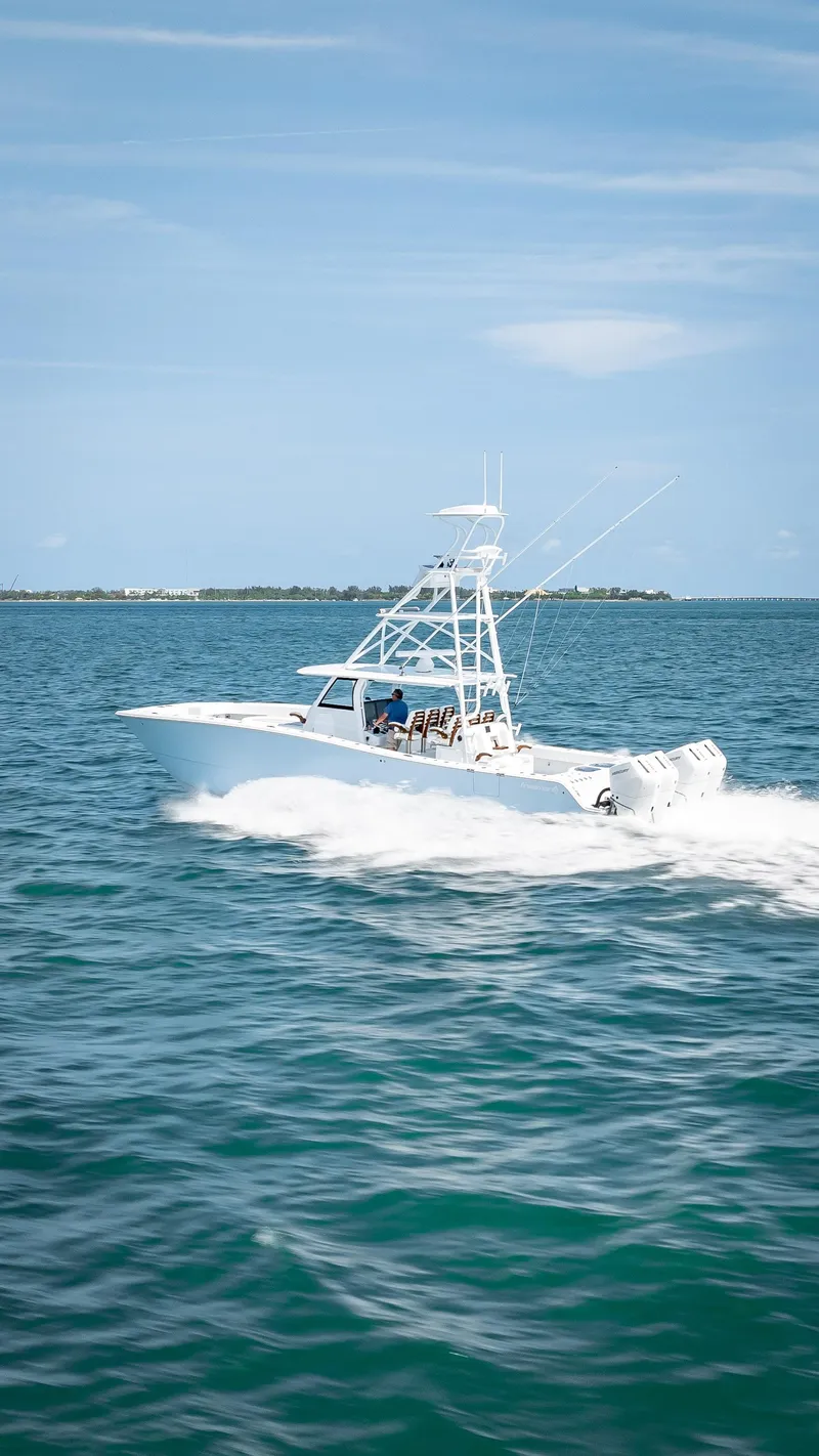 Slide: The Image of Freeman NEW 2024 boat with QUAD V10s 400 HP engines cruising on the ocean. - 32