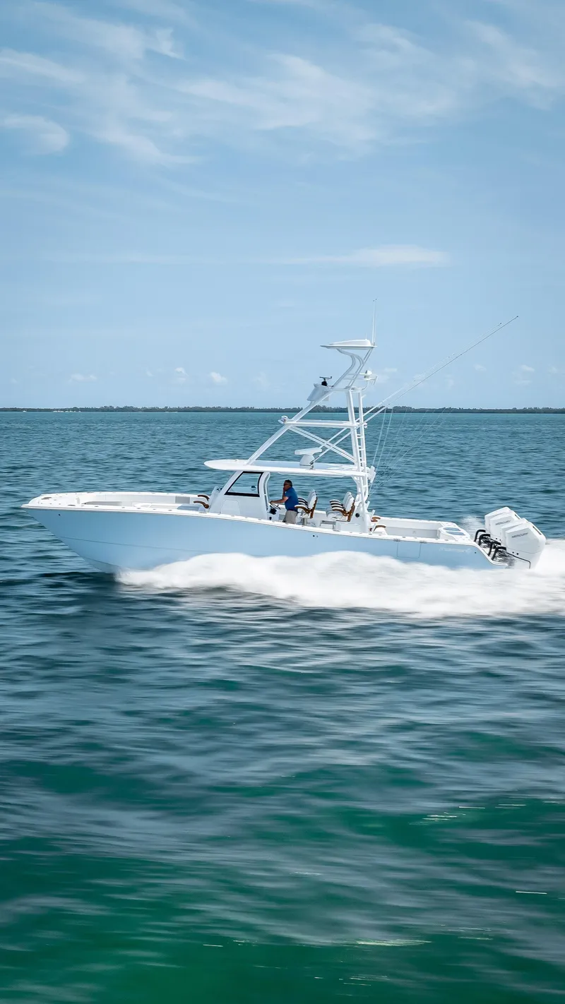 Slide: The Image of Freeman NEW 2024 boat with Quad V10s 400 HP engines cruising on the ocean. - 34