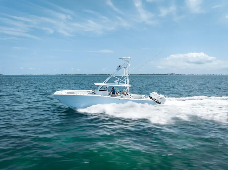 Slide: The Image of 2024 Freeman NEW QUAD V10s 400 HP boat cruising on open water - 35