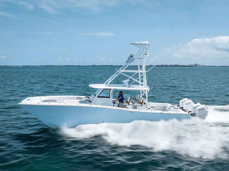 Slide: The Image of 2024 Freeman NEW QUAD V10s 400 HP boat cruising on open water. - 36