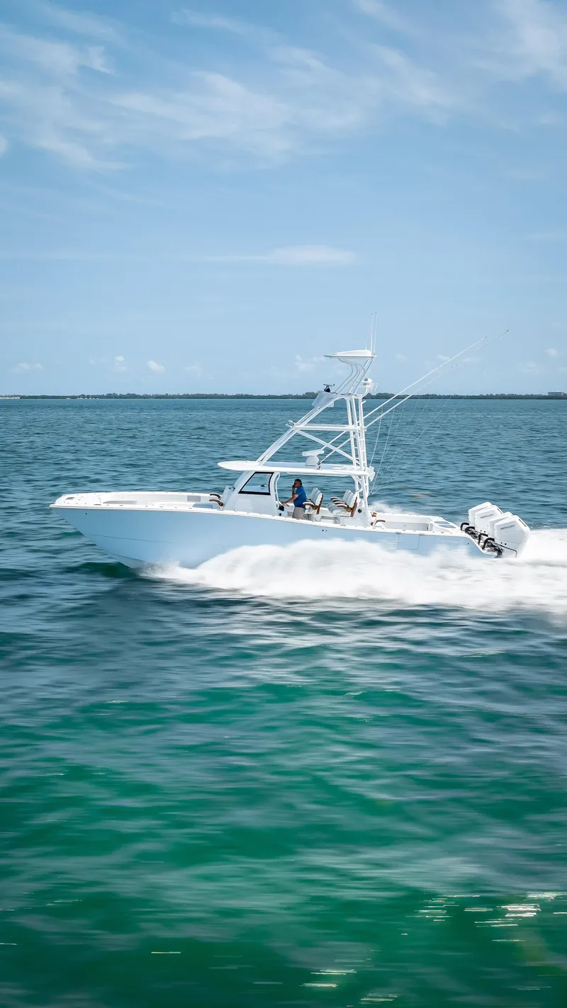 Slide: The Image of Freeman NEW 2024 boat with Quad V10s 400 HP engines cruising on the ocean. - 38