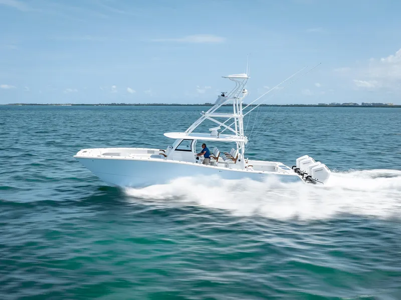 Slide: The Image of 2024 Freeman NEW QUAD V10s 400 HP boat cruising on open water. - 39