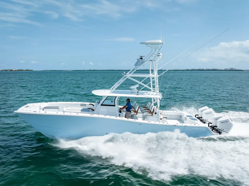 Slide: The Image of 2024 Freeman NEW QUAD V10s 400 HP boat cruising on open water. - 40