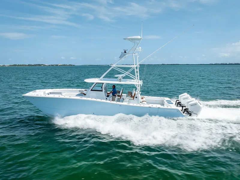 Slide: The Image of 2024 Freeman NEW QUAD V10s 400 HP boat cruising on the ocean. - 41