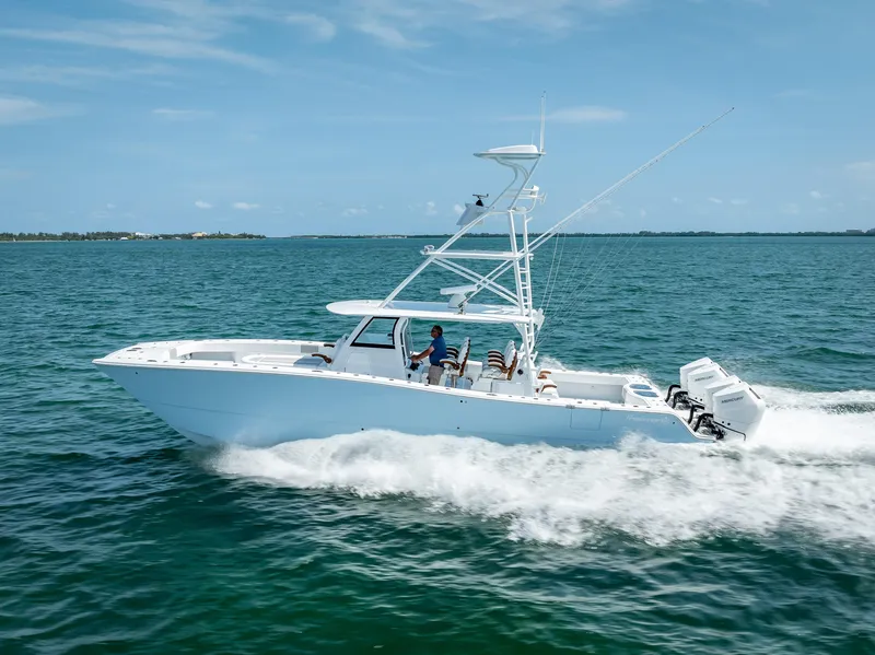 Slide: The Image of 2024 Freeman NEW QUAD V10s 400 HP boat cruising on open water. - 42