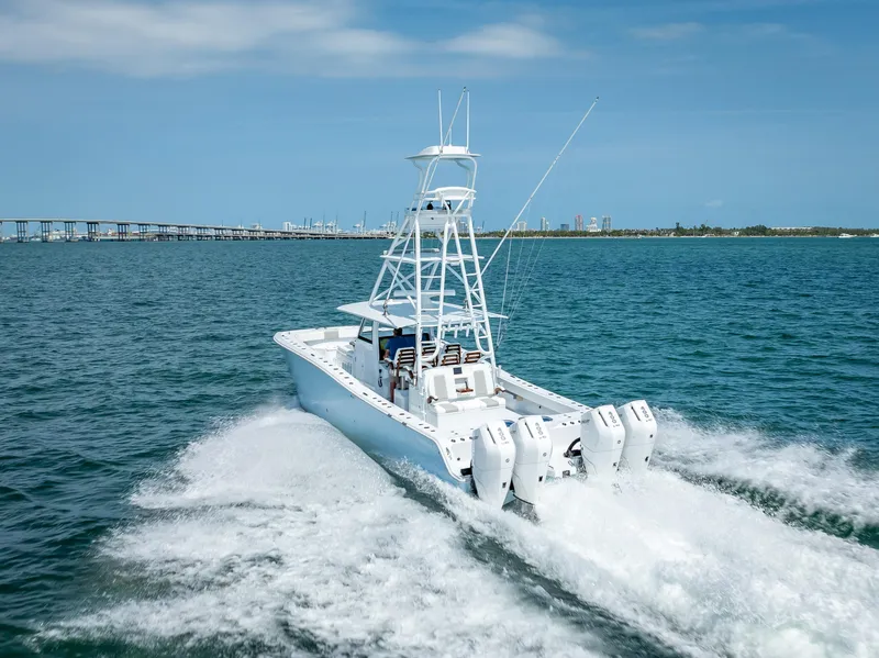 Slide: The Image of Freeman NEW 2024 boat with quad V10s 400 HP engines cruising on open water. - 43